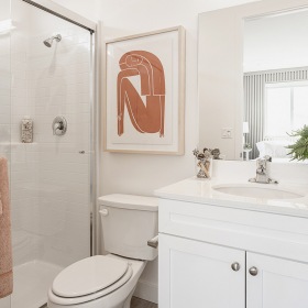 Bathroom Large well lit bedroom with plush carpets and large windows